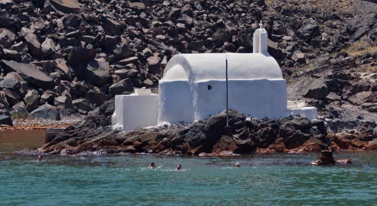 Dipping into the therapeutic green sulphur water of the Santorini hot springs