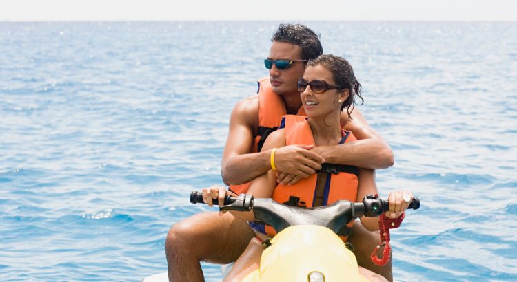 Couple Riding Jet Ski in Santorini Greece